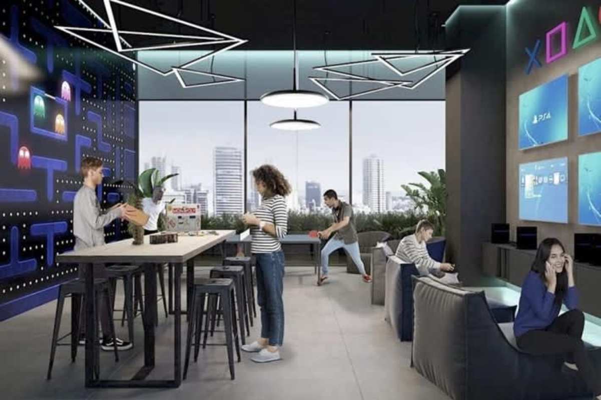 Green landscaped courtyard with flowers and seating at PH More El Cangrejo