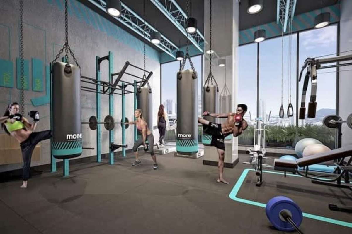 State-of-the-art gym with large windows and city views at PH More El Cangrejo