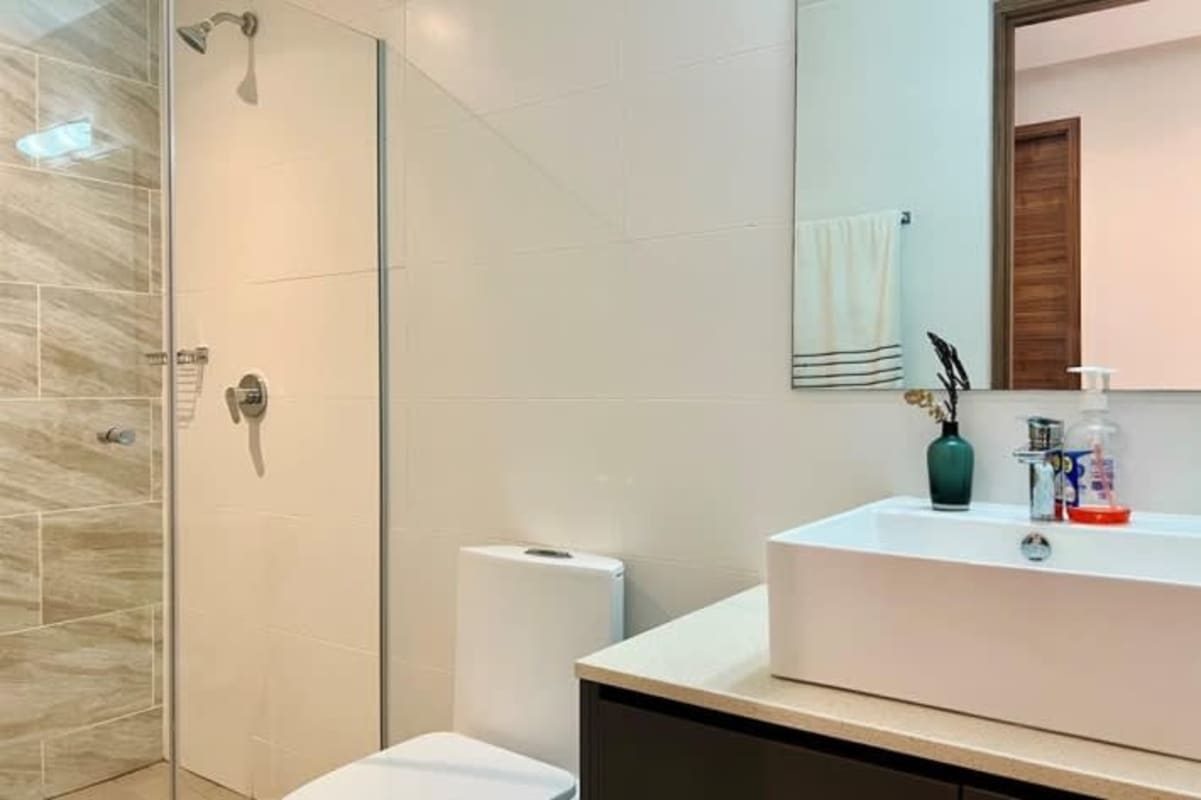 Bathroom with glass-enclosed shower and stylish fixtures at PH Isabella San Francisco Panama City
