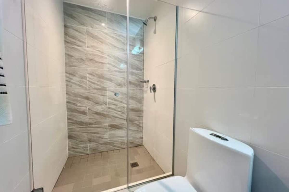 Bright second bedroom with large window and city skyline view PH Isabella San Francisco Panama