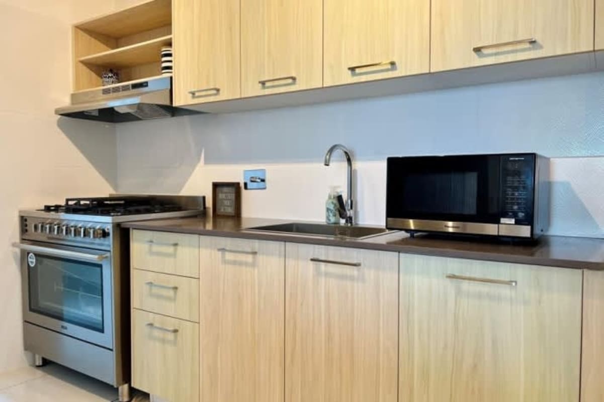 Modern living dining space with balcony city views in PH Isabella next to Parque Omar Panama City