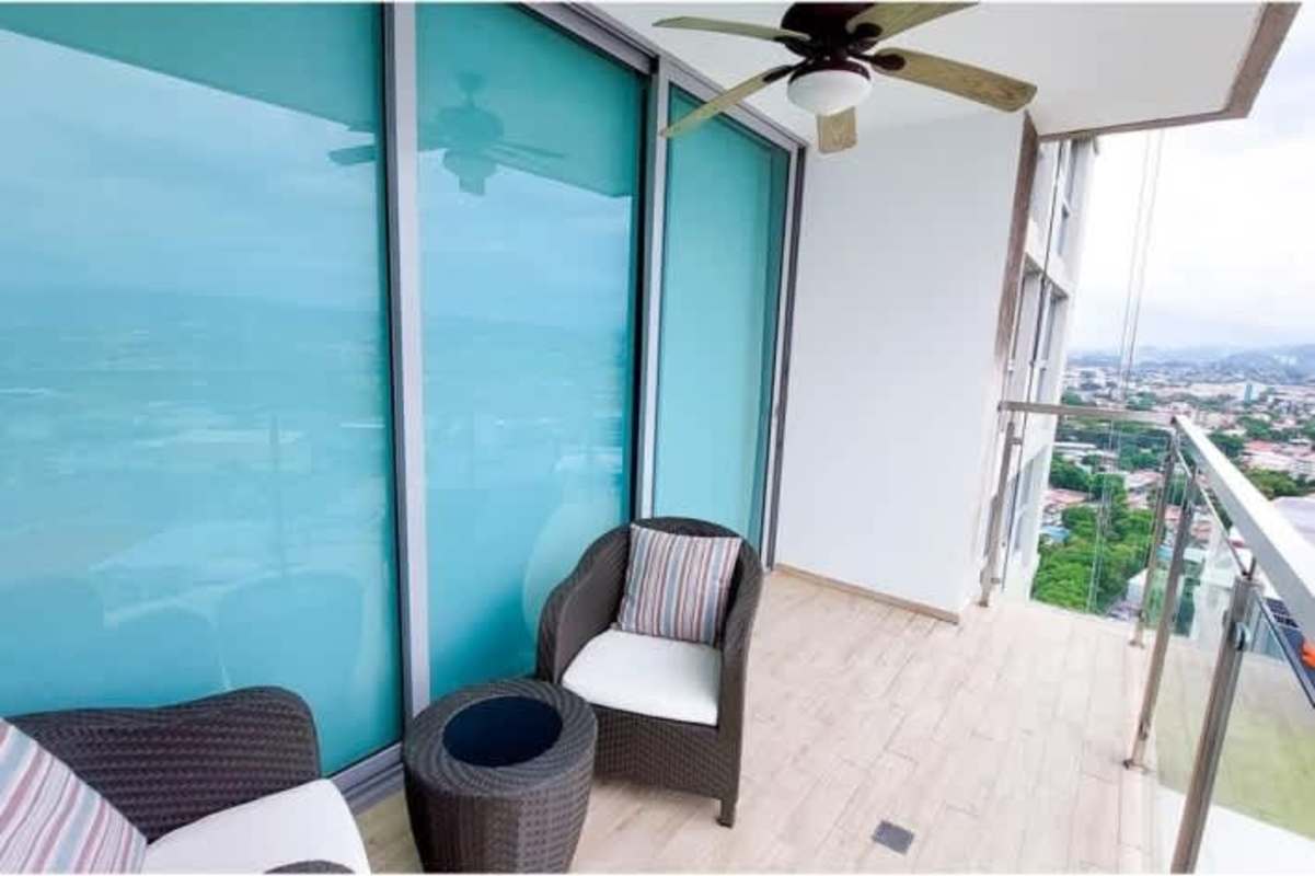 Living and dining area with large windows and natural light in PH Oceana Costa del Este Panama