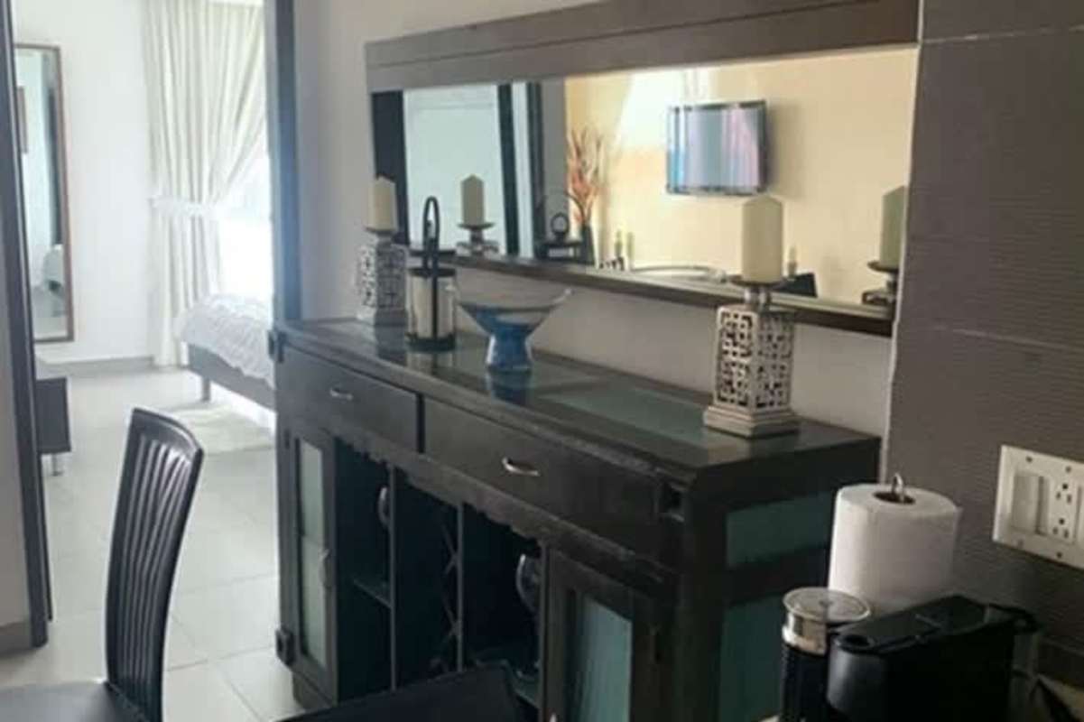 Modern bathroom with marble countertop, double vessel sinks and glass shower in PH BICSA Tower condo Panama City