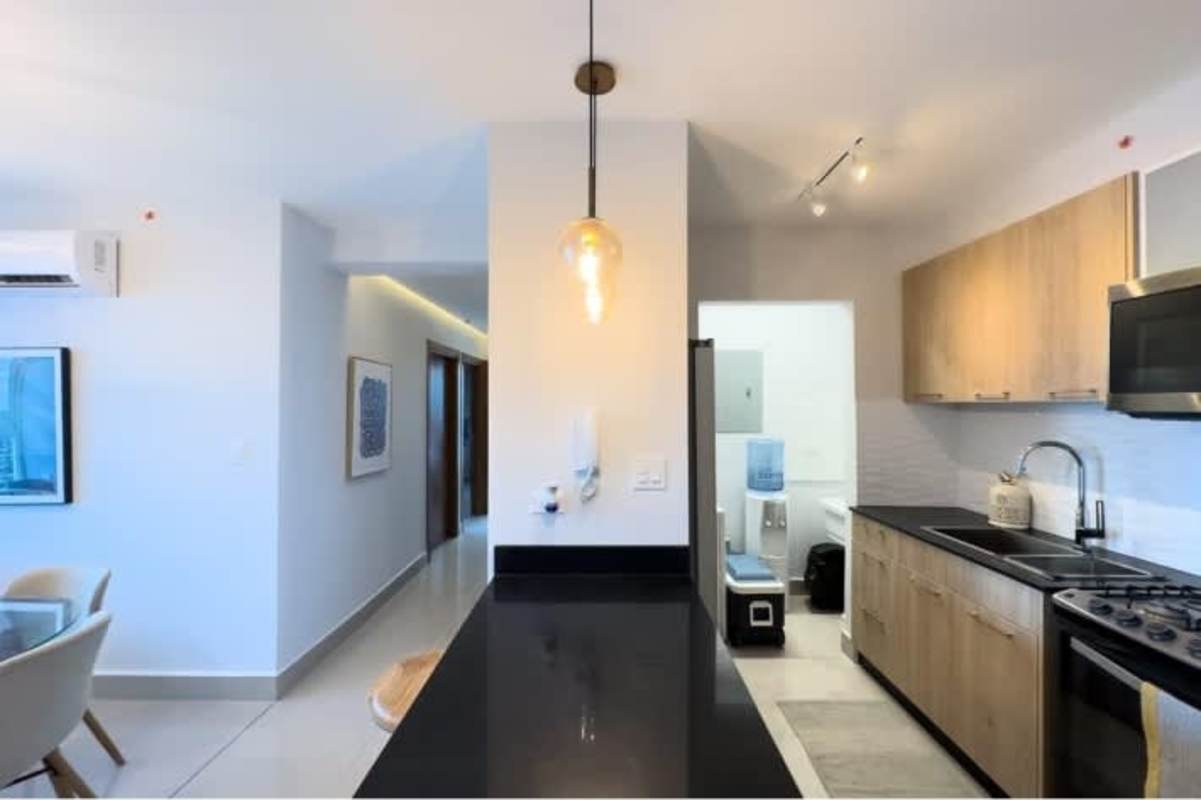 Modern kitchen with cabinets and breakfast counter in Alto Río Vía España