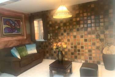 Bedroom with built-in closet, window, tiled floors in Paseo Miramar house La Chorrera