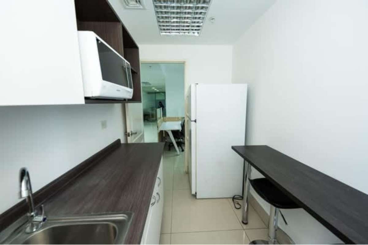 Modern office bathroom with vanity and mirror in PH BICSA Financial Center Panama