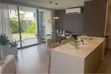 Dining room bright windows garden landscape Panama Pacifico house