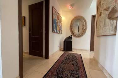 Bright open living dining room with large windows and terrace access in Tucan Country Club Villa Panama