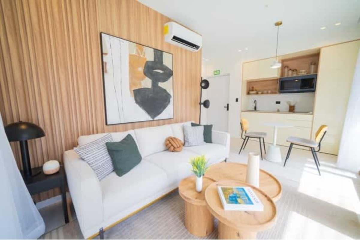 Minimalist bathroom with glass shower, wall-mounted sink, hex tile floor in new Bella Vista apartment project Panama City