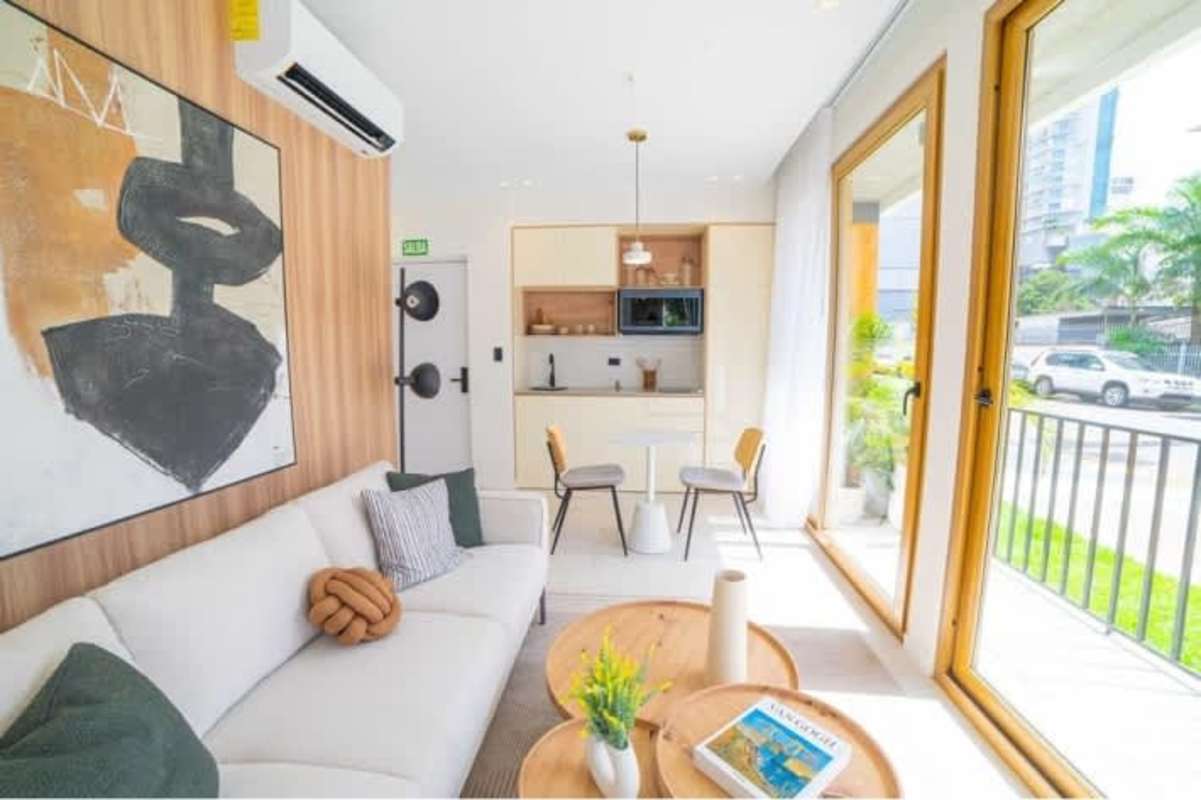 Modern minimalist open concept living with large balcony window Bella Vista Panama apartment