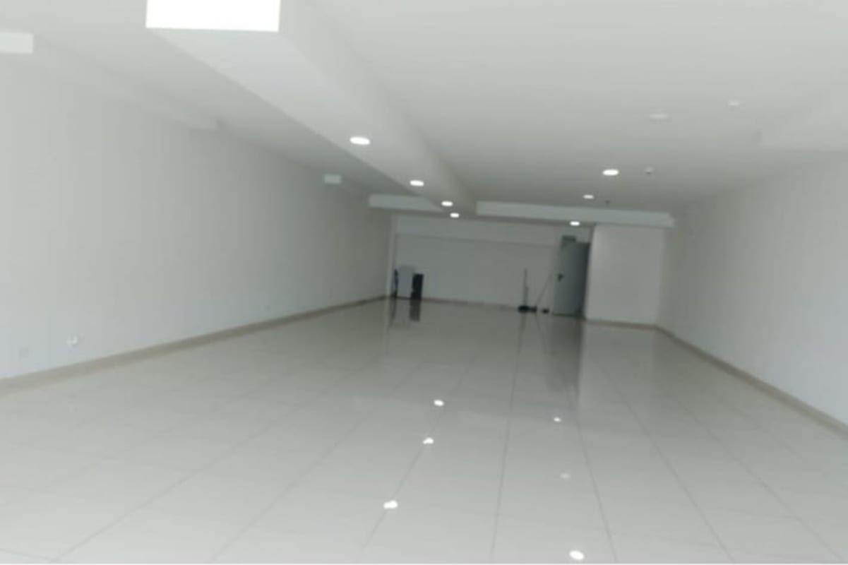 Empty commercial open space with tiled floors inside Signature Point tower Bella Vista Panama