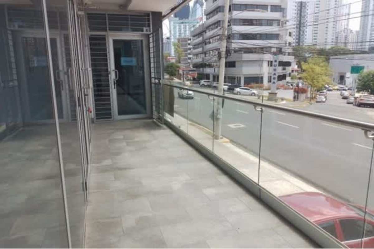 Balcony with glass railing overlooking downtown Panama street from Signature Point Bella Vista