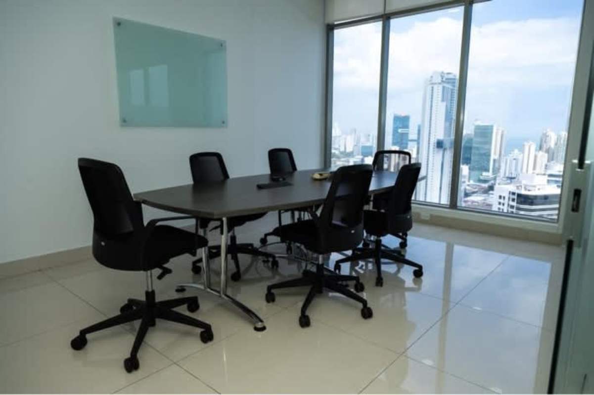 Modern conference room featuring ocean skyline views and glass whiteboard PH BICSA Tower Panama City