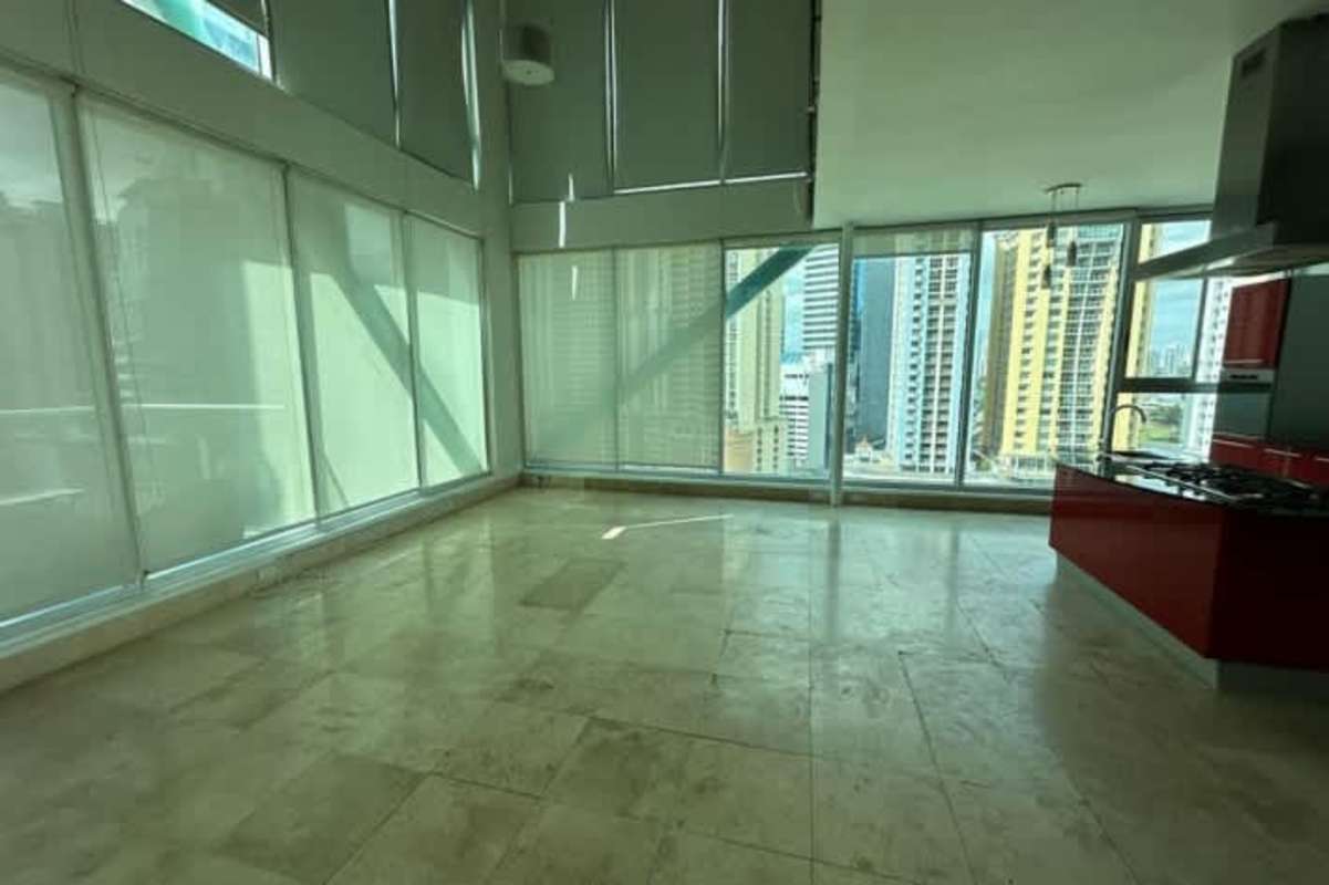 Modern loft bedroom with glass partitions walk-in closet and balcony view at PH Loft Four 41 Panama City