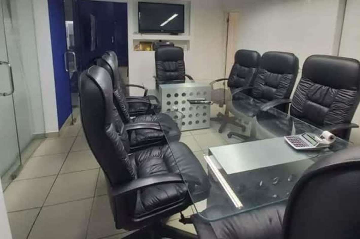 Modern conference room with glass table leather chairs TV Hi-Tech Plaza Obarrio