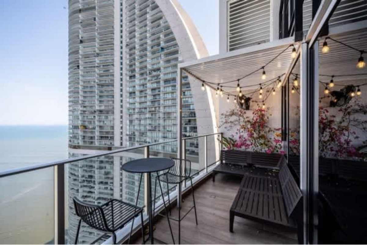 Spacious bedroom with water views balcony at PH Pacifica Village Panama