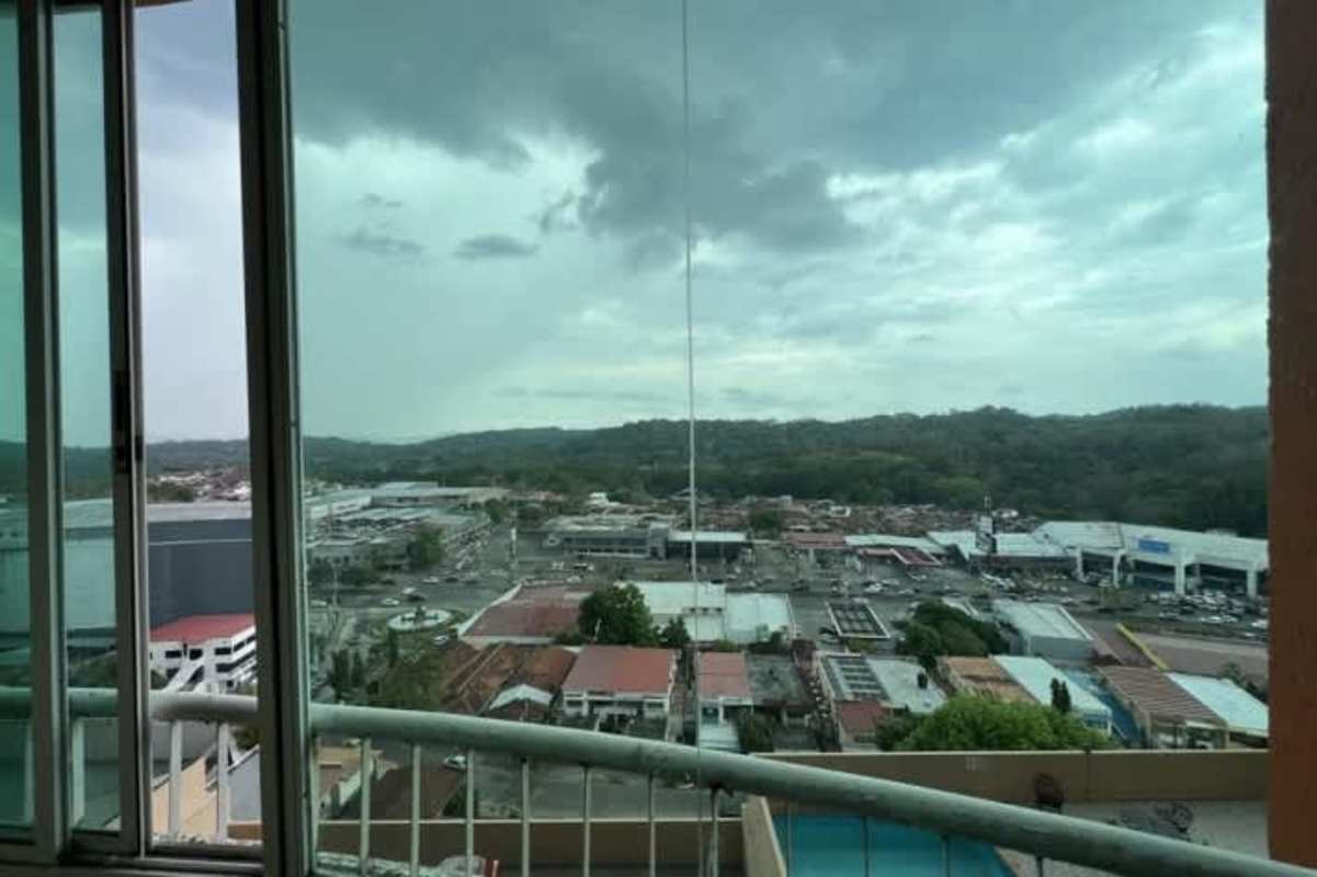 Balcony with city view overlooking commercial and green hills PH Royal Hill Betania Panama