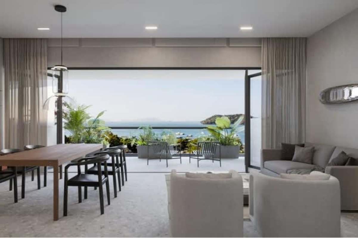 Stylish living-dining area with private ocean view balcony in The Passage luxury condo Amador Panama