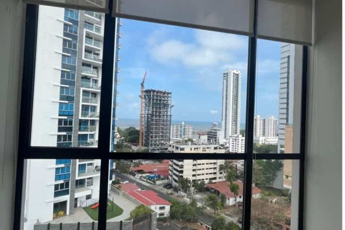 Modern bedroom featuring floor-to-ceiling windows skyline view tile floors in PH Coco Skyline Coco del Mar Panama