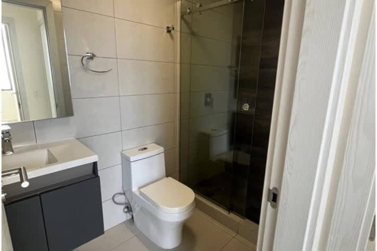 Modern bathroom with vanity mirror glass walk-in shower PH Coco Skyline Coco del Mar Panama