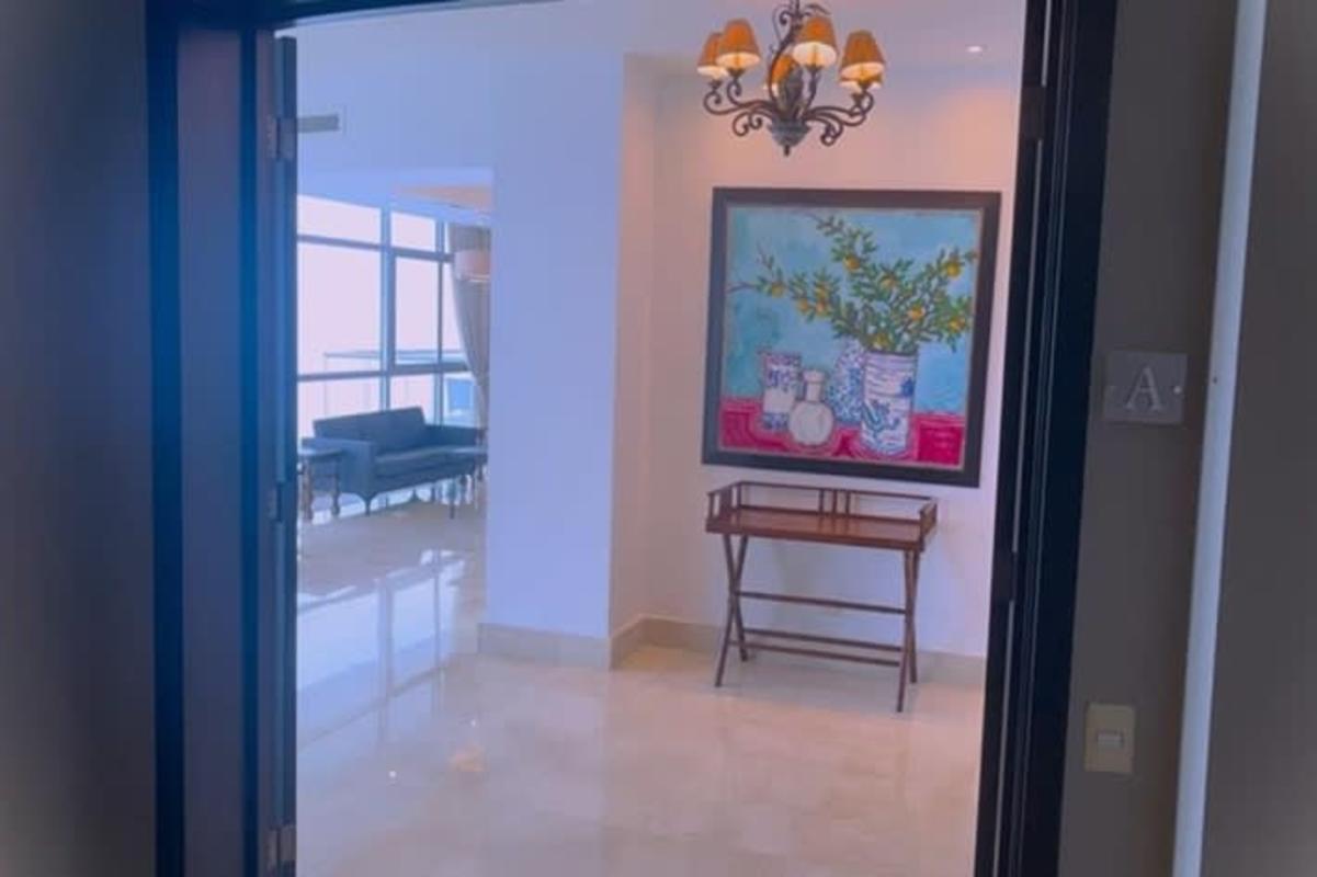 Modern master bedroom with floor-to-ceiling windows ocean view balcony PH Costa del Este Tower Panama