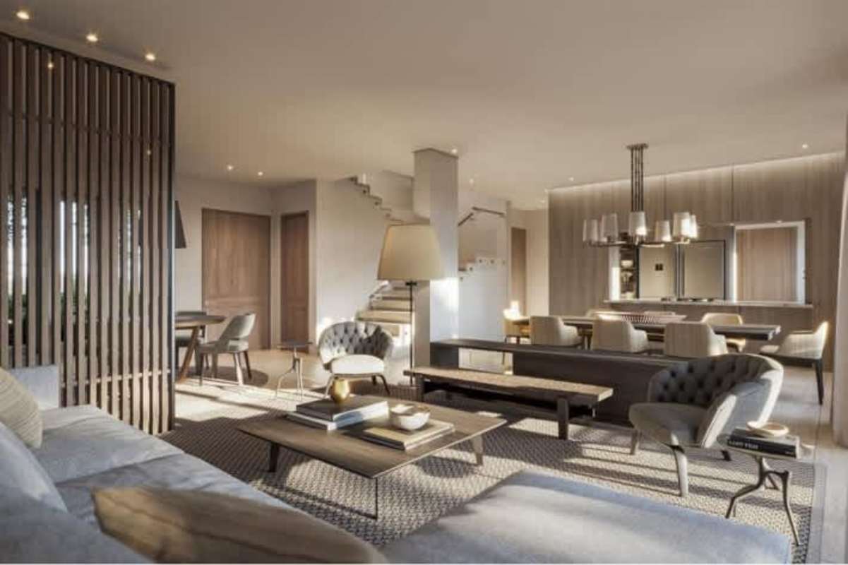 Luxurious living room space with large windows and elegant decor at Santa María Golf