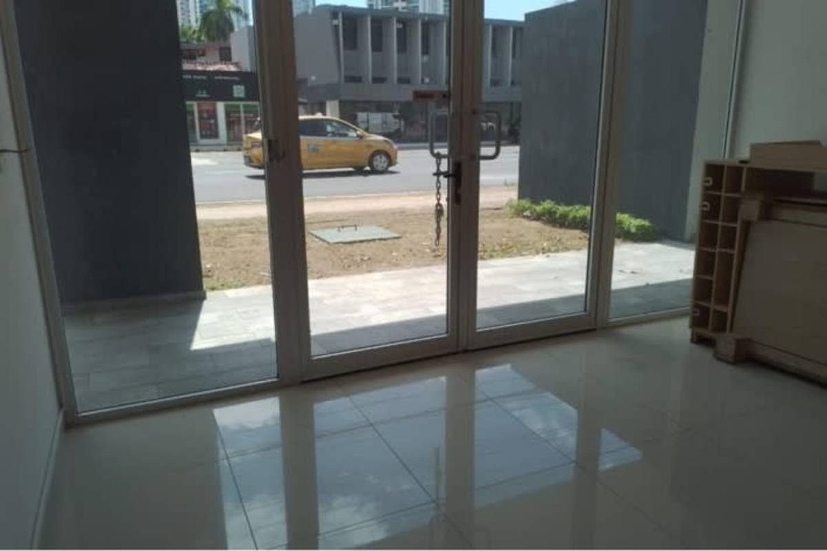 Interior commercial space with large glass doors tile flooring at Signature Point Bella Vista Panama City