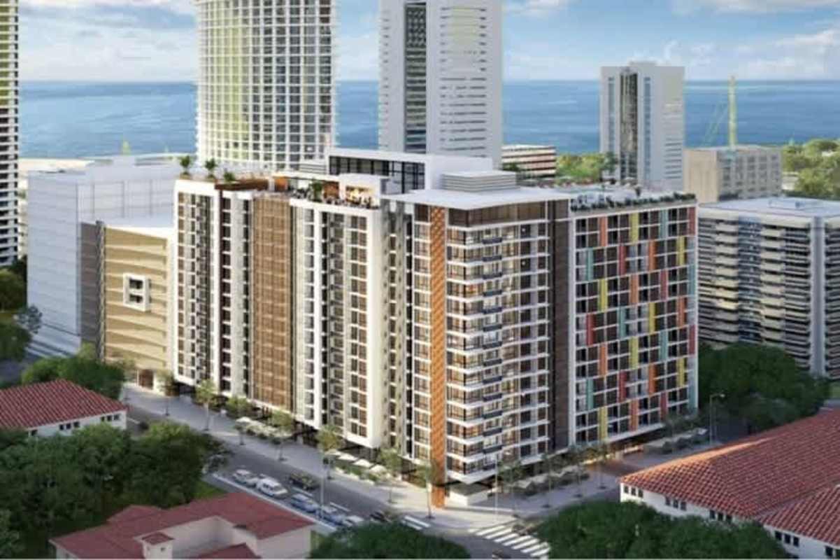 Aerial view modern apartment tower colorful facade urban coastal Panama cityscape Balboa District