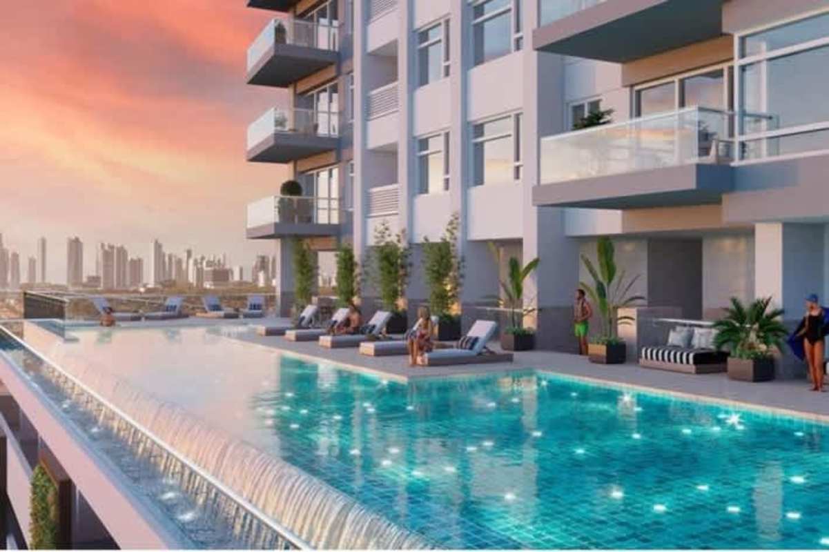 Rooftop infinity pool in Santa María Golf Residences with city skyline backdrop