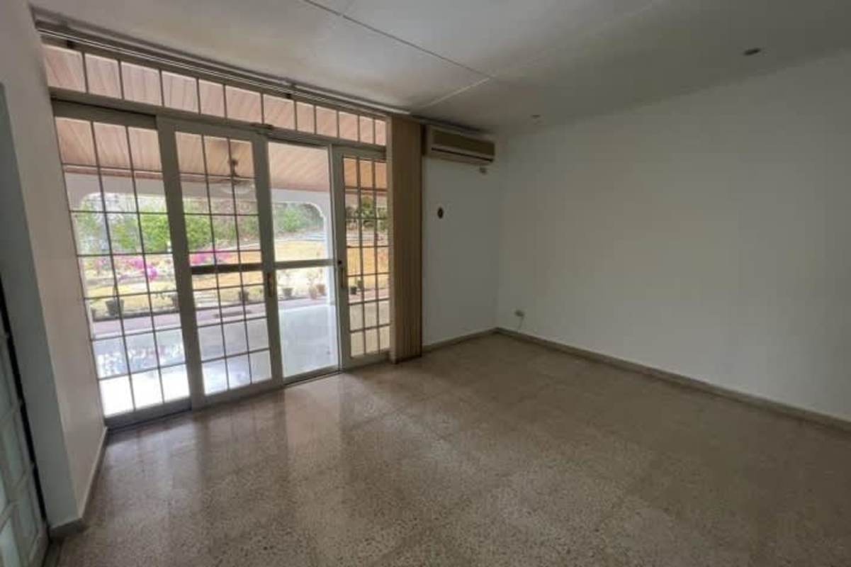 Spacious kitchen with colorful tile backsplash, granite counters, large windows in Hato Pintado Panama