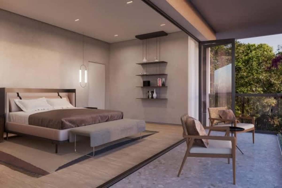 Open-plan living dining area with large glass doors and bay view at Amador Causeway