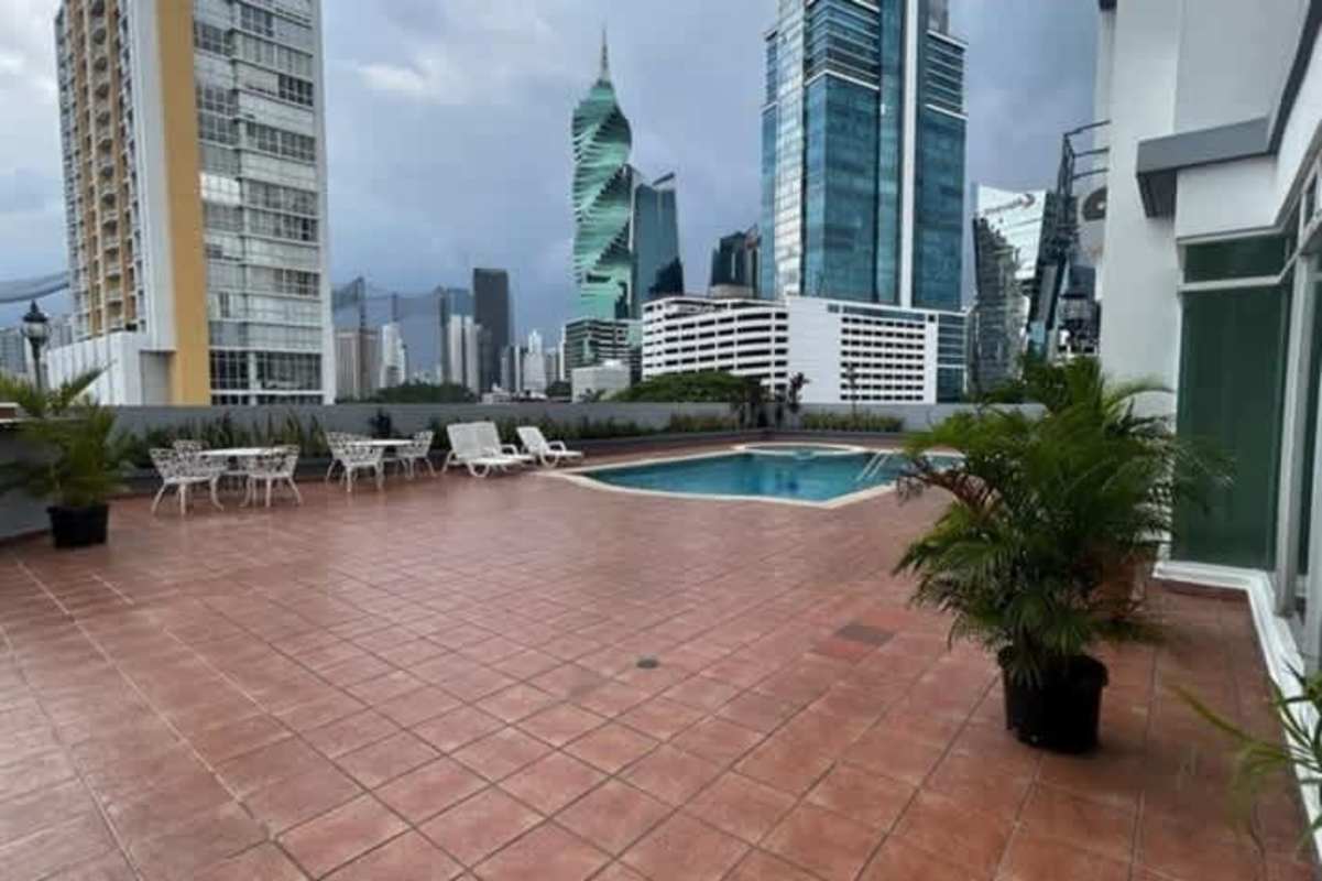 Outdoor swimming pool with terrace overlooking Panama skyline PH San Francisco Central