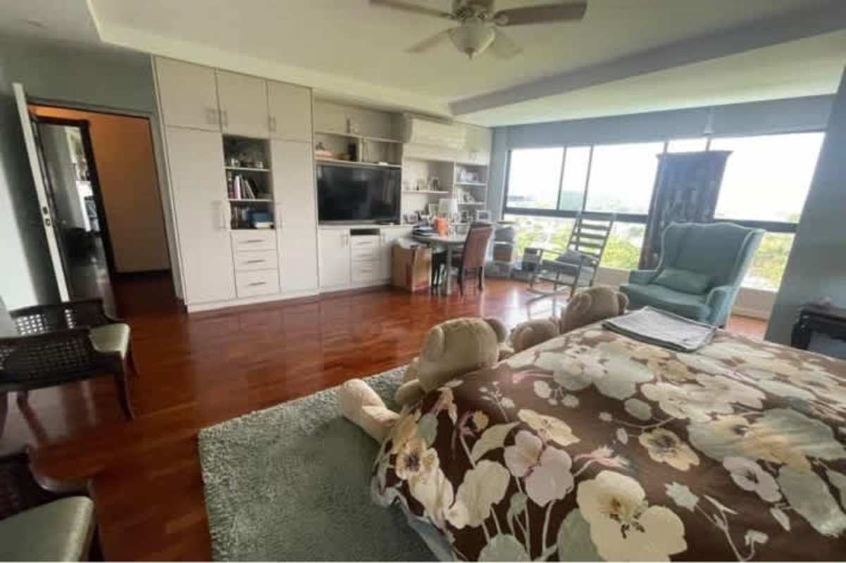 Large balcony with seating, plants, skyline views and glass railing in Bella Vista Panama