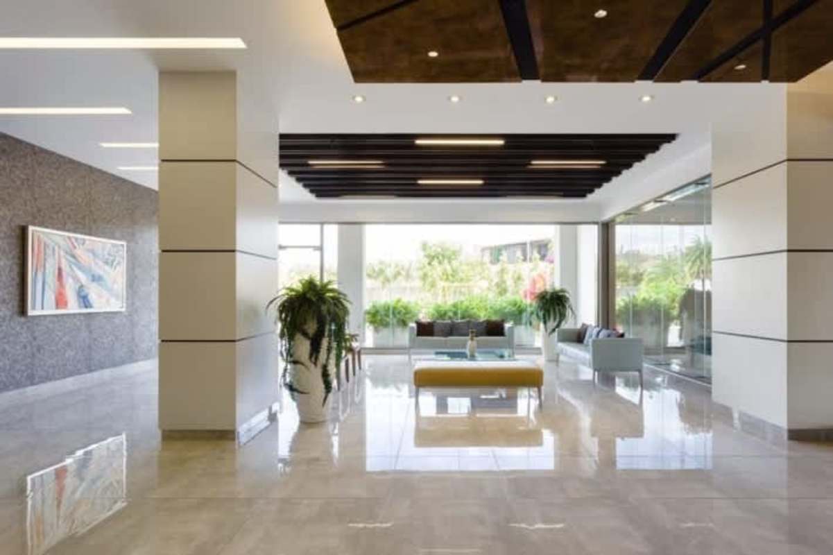 Double height lobby with reception area in PH Betania Park Panama City