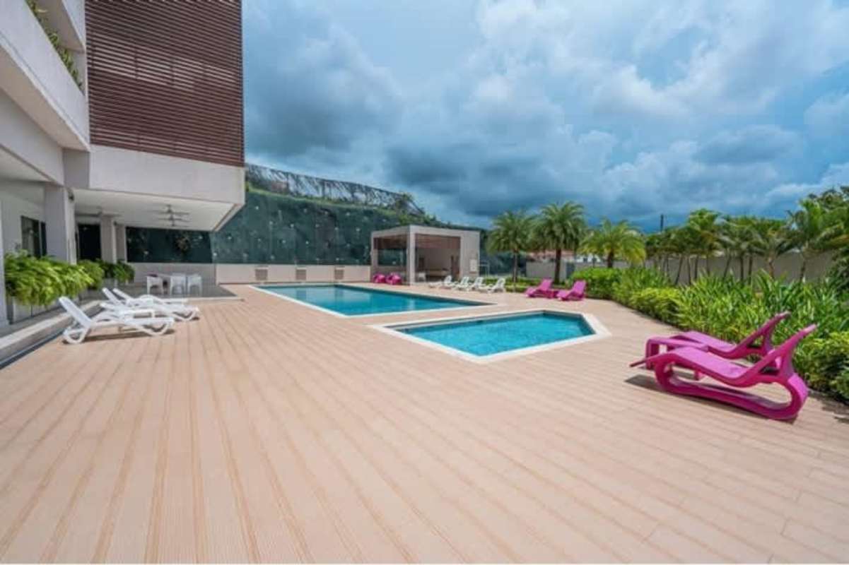 Infinity pool with lounge chairs at PH Betania Park Panama City