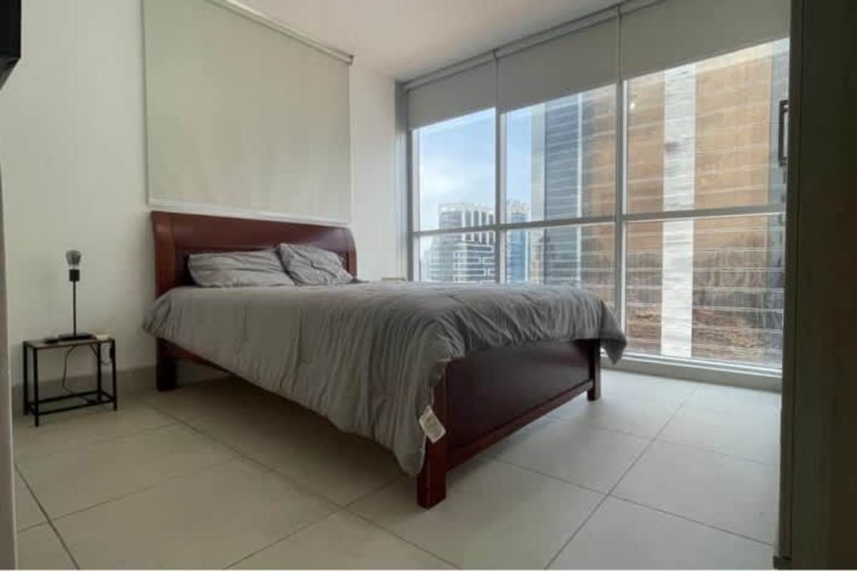 Bedroom with skyline view large windows roller blinds Obarrio rental