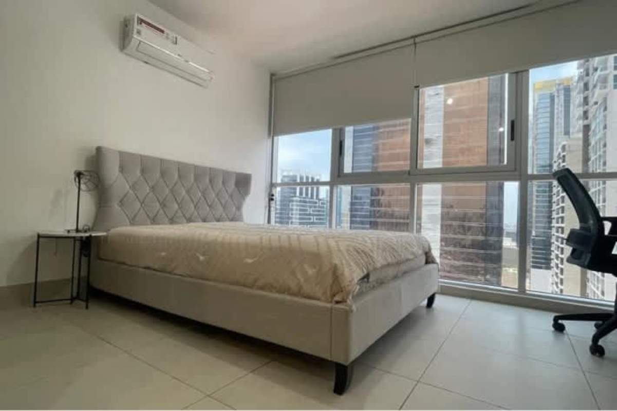 Bedroom large windows with panoramic city views in Obarrio rental Panama City