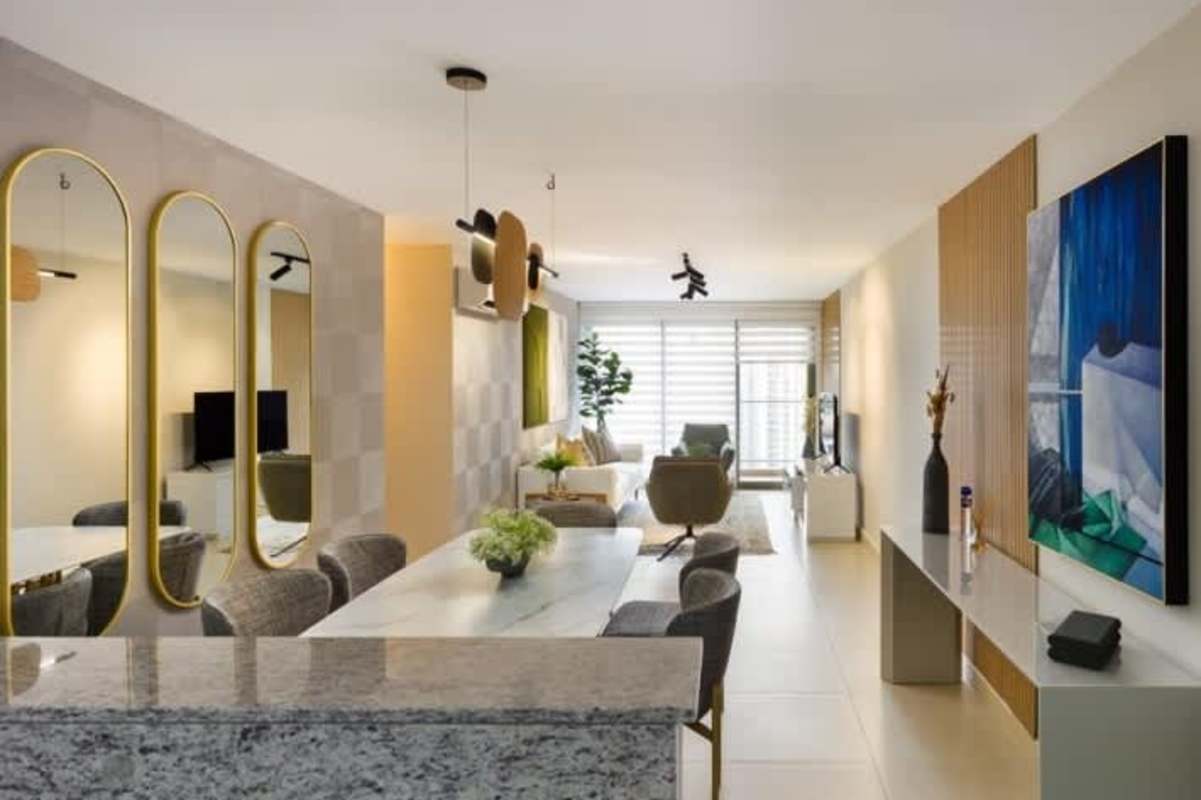 Modern kitchen with granite countertops and wood cabinetry in Betania Tower Panama City