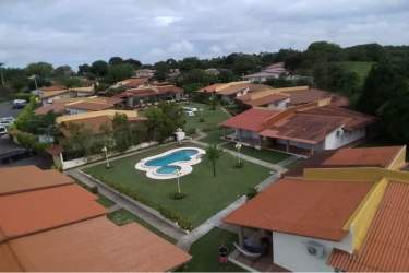 Aerial drone shot residential community PH Villa Brisas pools lawns gardens Coronado Panama