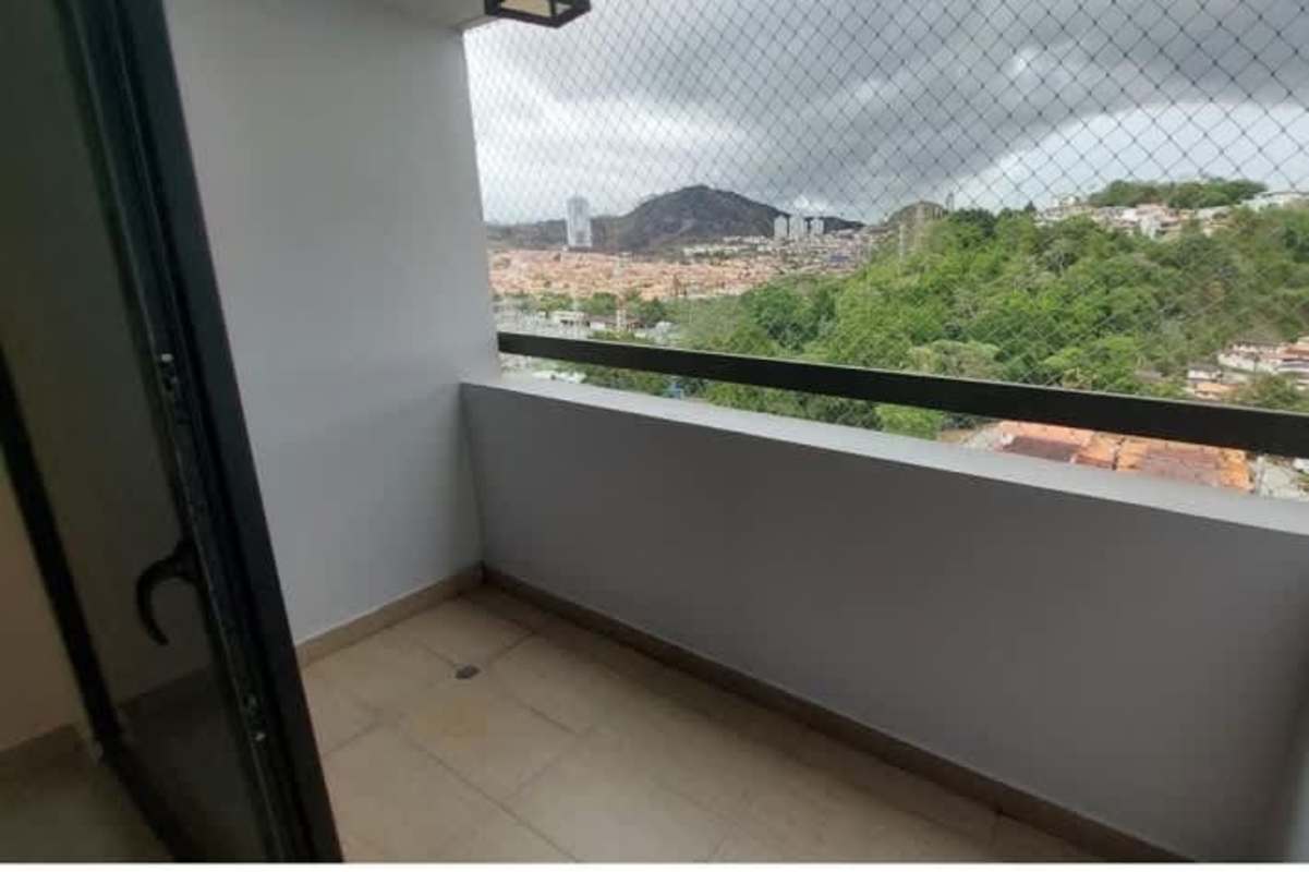 Bedroom featuring large window with city and mountain views, tiled floor, and AC-ready at Condado Country Club Panama