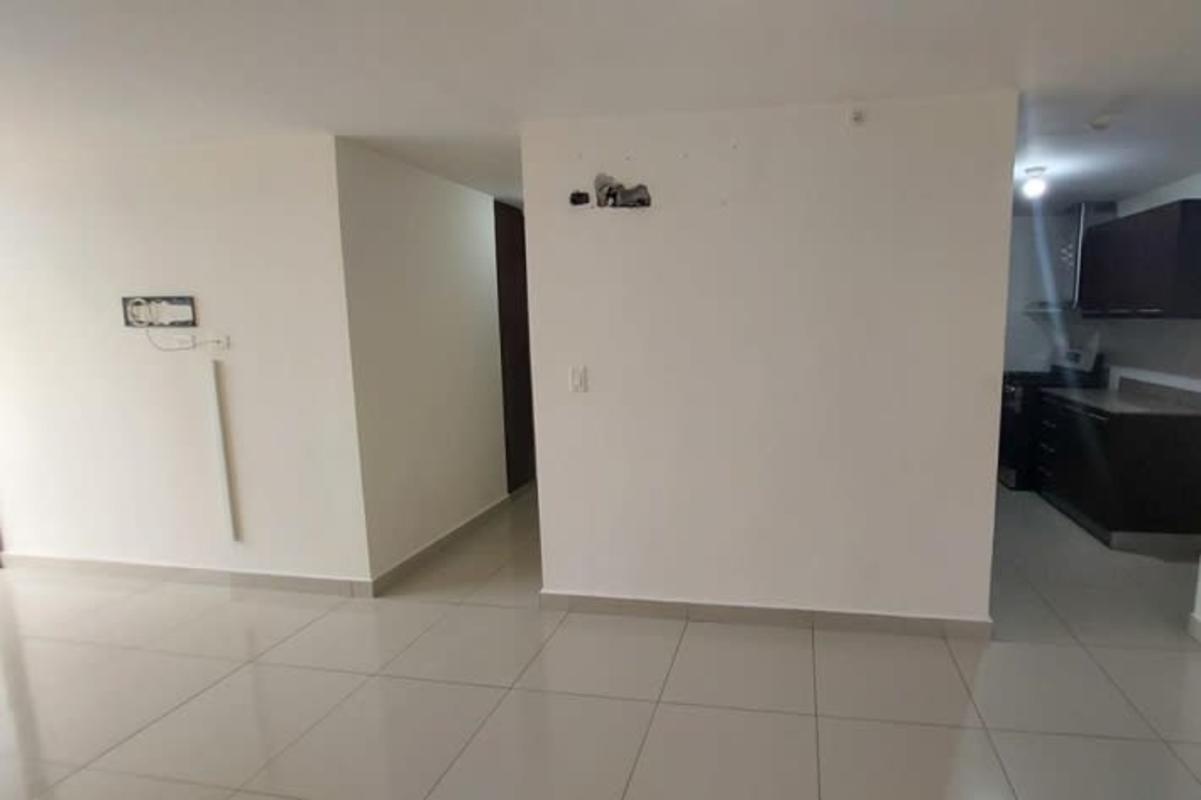 Modern condo development pool area with tall buildings, palm trees at Condado Country Club in Condado del Rey Panama