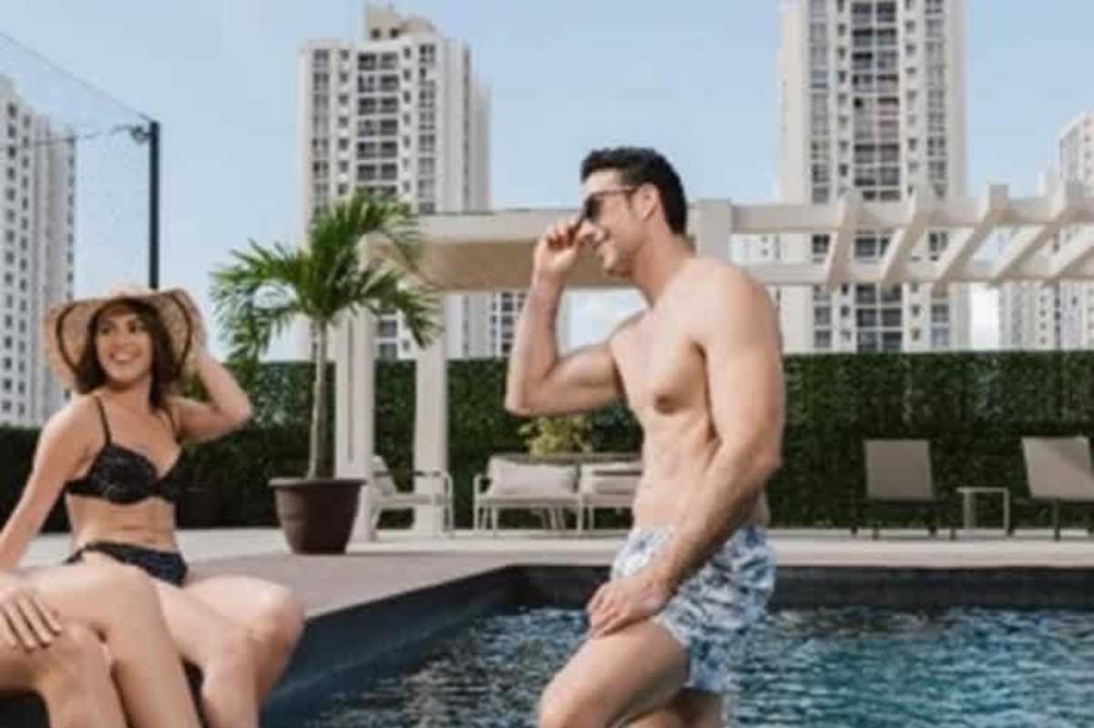 Luxury swimming pool with pergola lounge and city view at Altamira Gardens Condado del Rey Panama City