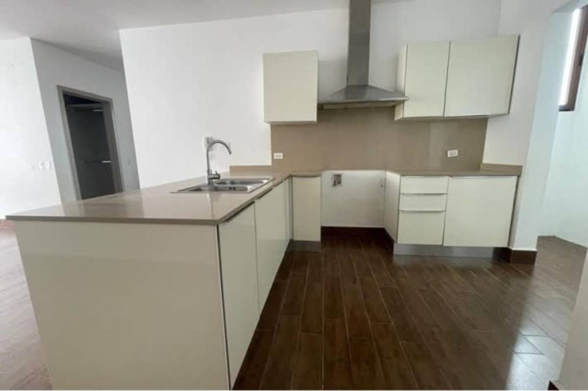 Modern bedroom with window and built-in closet at Costa Sur Club Residences Panama