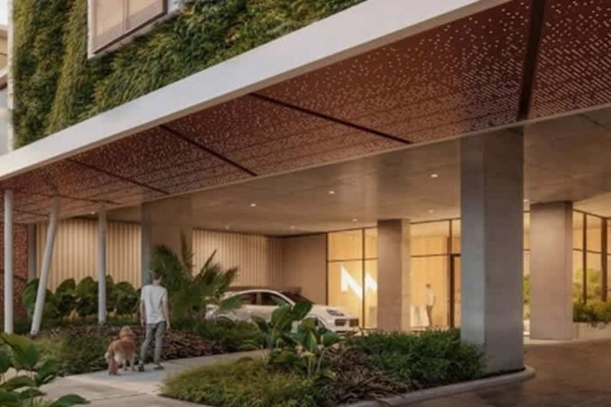 Building entrance with vertical garden, landscaping, and driveway at PH Bella Vista Smart Panama City