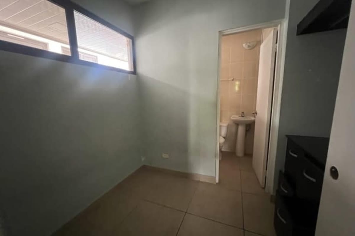 Covered outdoor patio with pergola, stone accented wall and garden in PH Mont Blanc Brisas del Golf Panama City