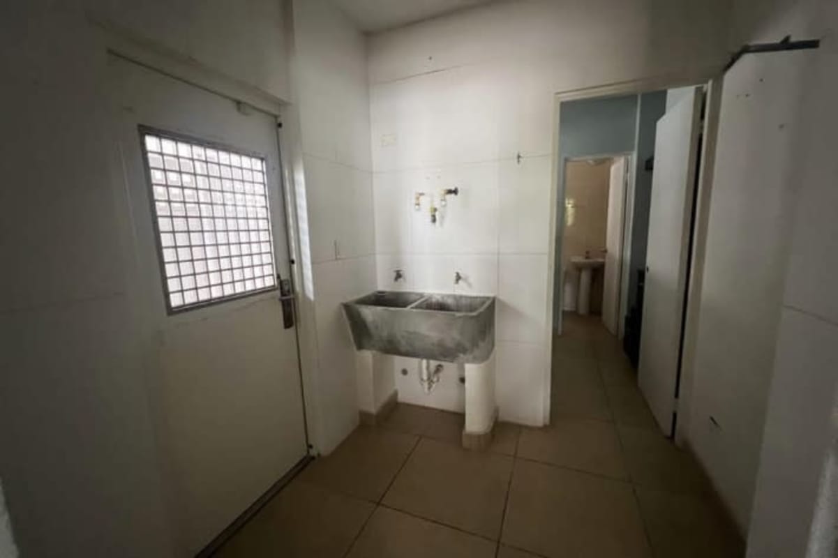 Large living area with sliding glass doors, tiled floors and accent wall in PH Mont Blanc Brisas del Golf Panama City