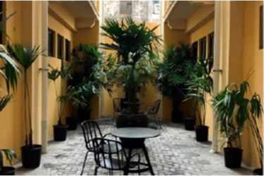 Colonial-inspired multi-story commercial building with balconies and storefronts in Casco Viejo Panama City
