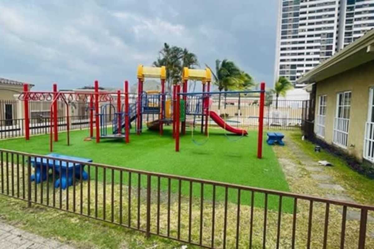 Family-friendly playground area with slides, swings in gated community Condado del Rey Panama