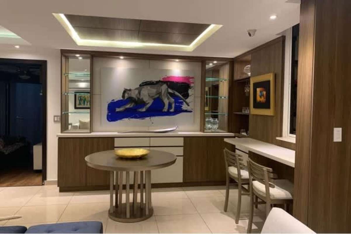 Contemporary kitchen with granite counters, cabinets and breakfast bar in PH Park City Obarrio Panama