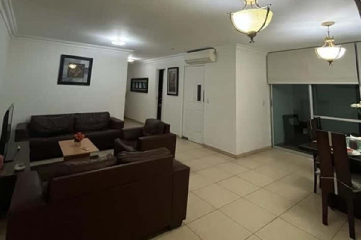 Bright bedroom with large window and city view in PH Parque del Mar Panama